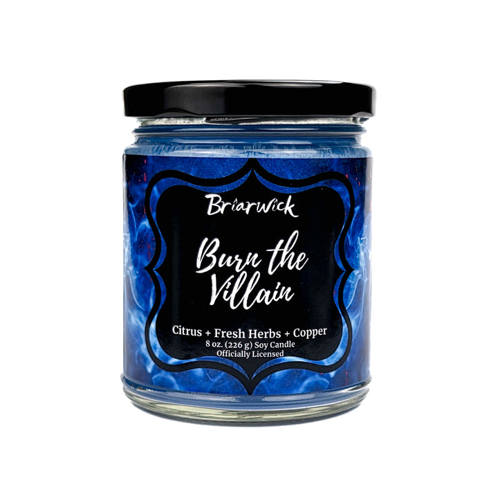 Jar of "Burn the Villain" candle with 'Briarwick' branding on a white background