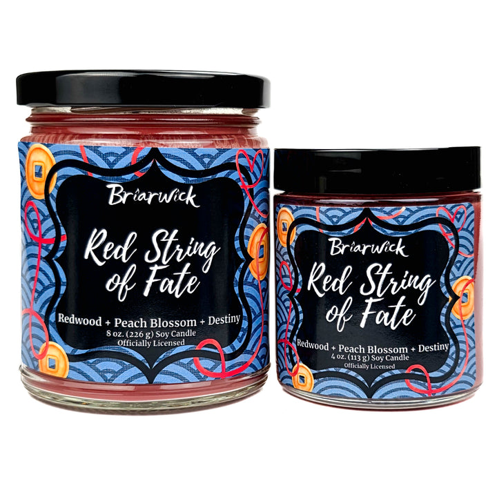 Two Briarwick candles labeled 'Red String of Fate' on a white background