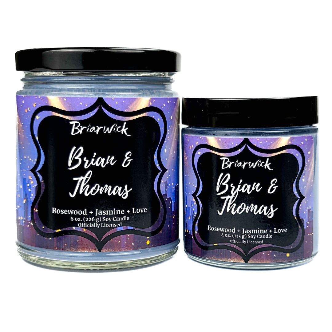 Two Briarwick candles labeled "Brian & Thomas" with black lids and colorful labels on a white background