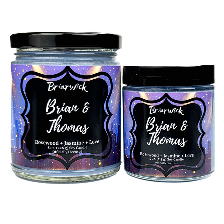 Two Briarwick candles labeled "Brian & Thomas" with black lids and colorful labels on a white background