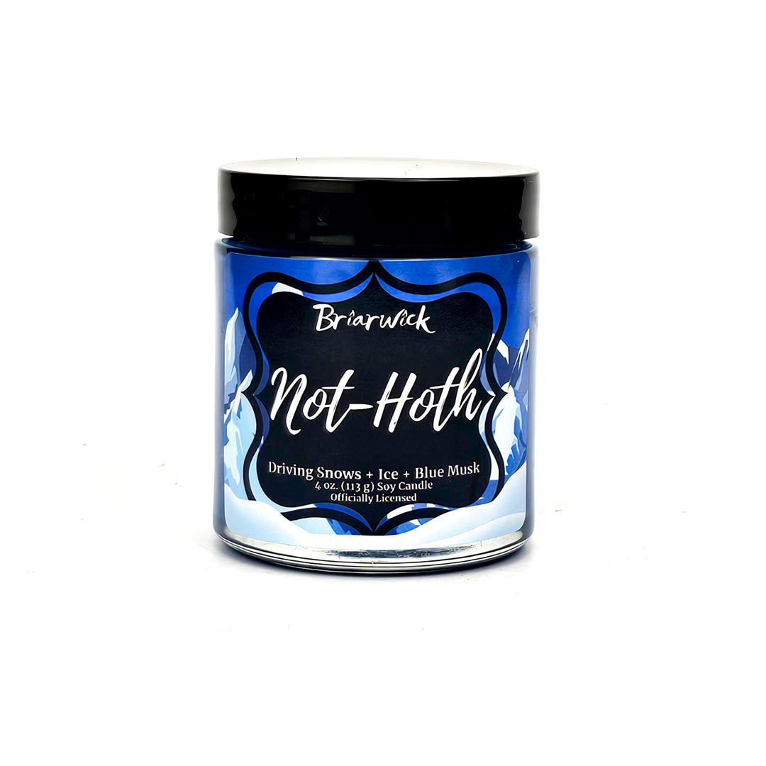 not-Hoth 4oz royal blue candle with white & blue mountain design on a white background