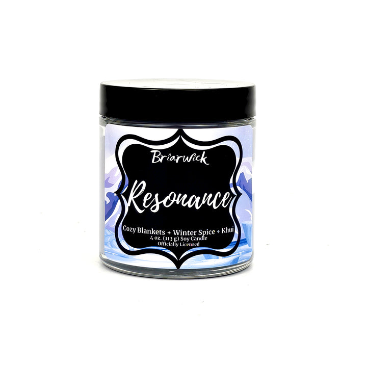 Resonance 4oz white candle with white mountain design on a white background