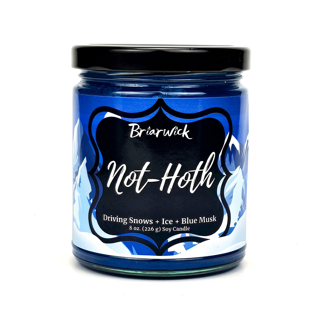 not-Hoth 8oz royal blue candle with white & blue mountain design on a white background