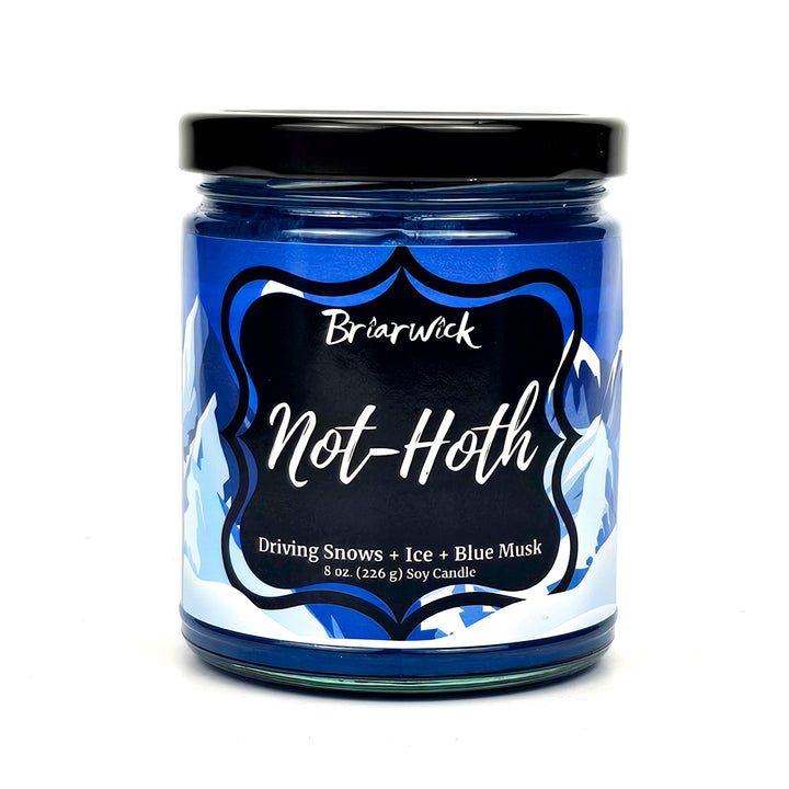 not-Hoth 8oz royal blue candle with white & blue mountain design on a white background