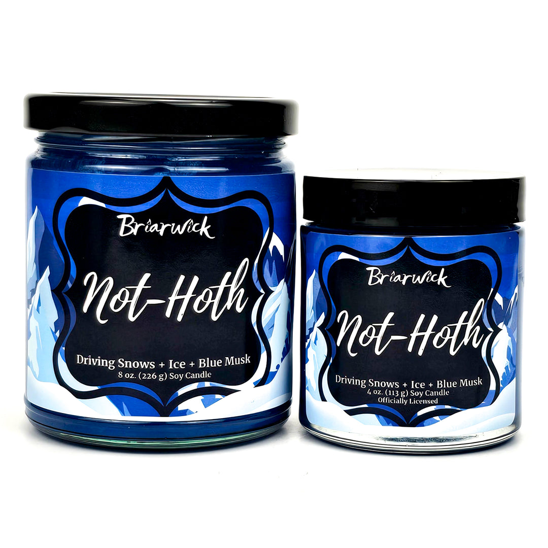 not-Hoth 8oz royal blue candle with white & blue mountain design on a white background
