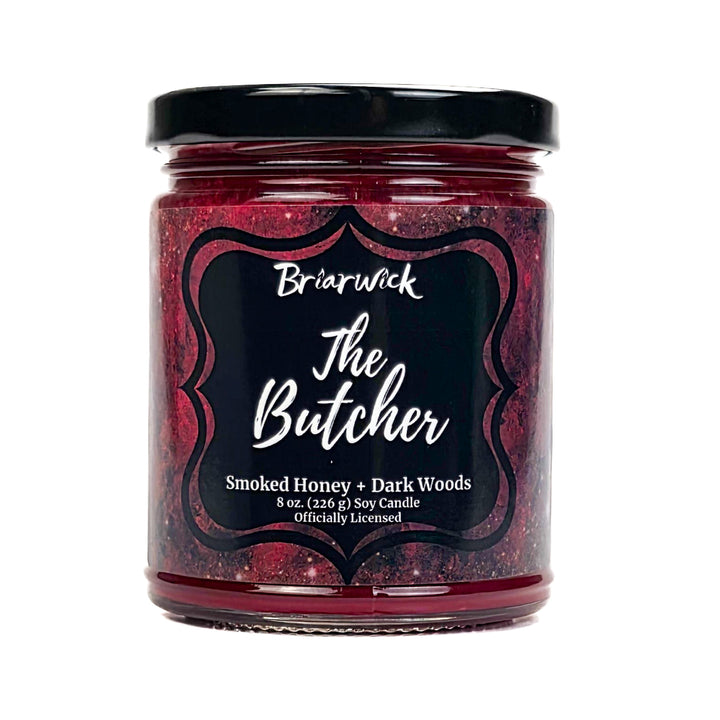 Jar of candle labeled 'The Butcher' by Briarwick with a black lid on a white background