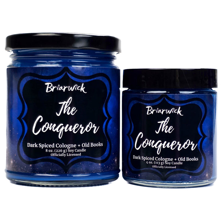 Two blue candles labeled 'The Conqueror' by Briarwick on a white background.