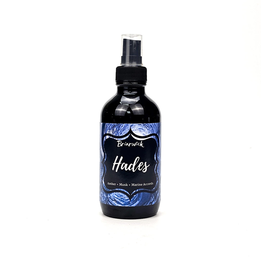 Hades 4oz Linen Spray with blue spiral design on a white background