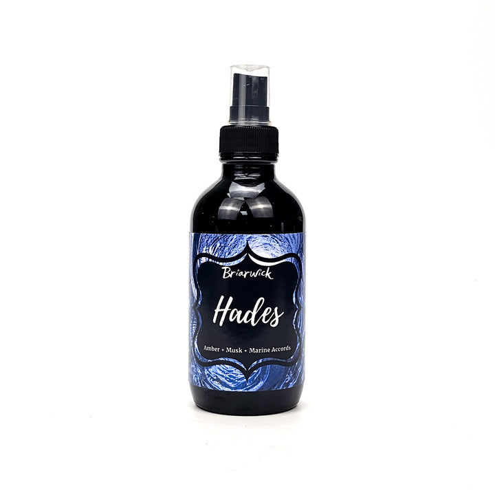 Hades 4oz Linen Spray with blue spiral design on a white background