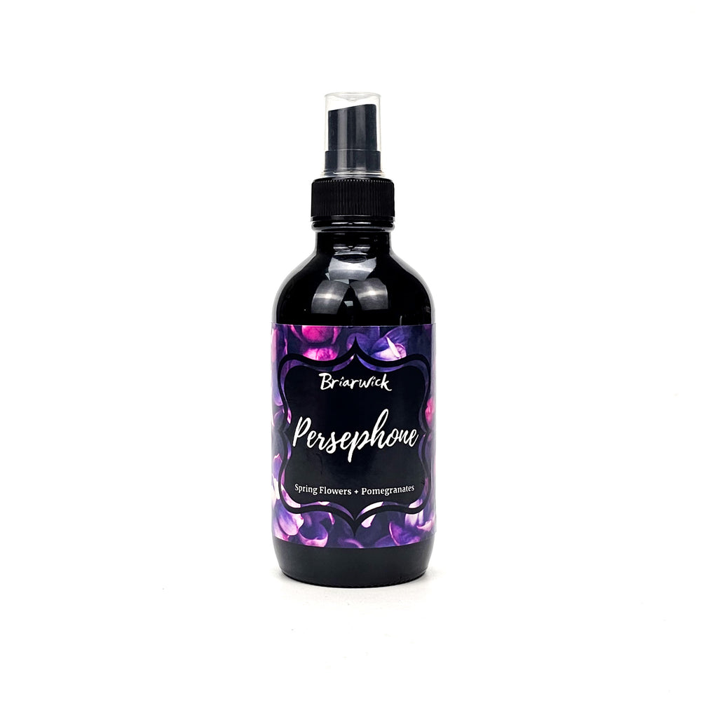 Persephone 4oz Linen Spray with a purple flower design on a white background
