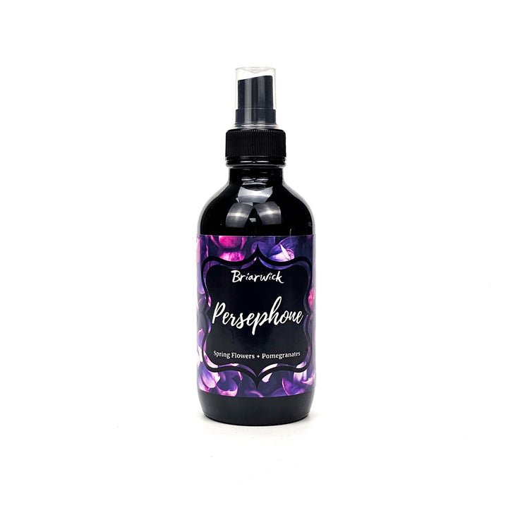 Persephone 4oz Linen Spray with a purple flower design on a white background