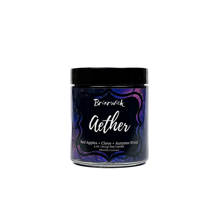 Aether 4oz deep purple candle with purple and gold marbled glitter label on a white background