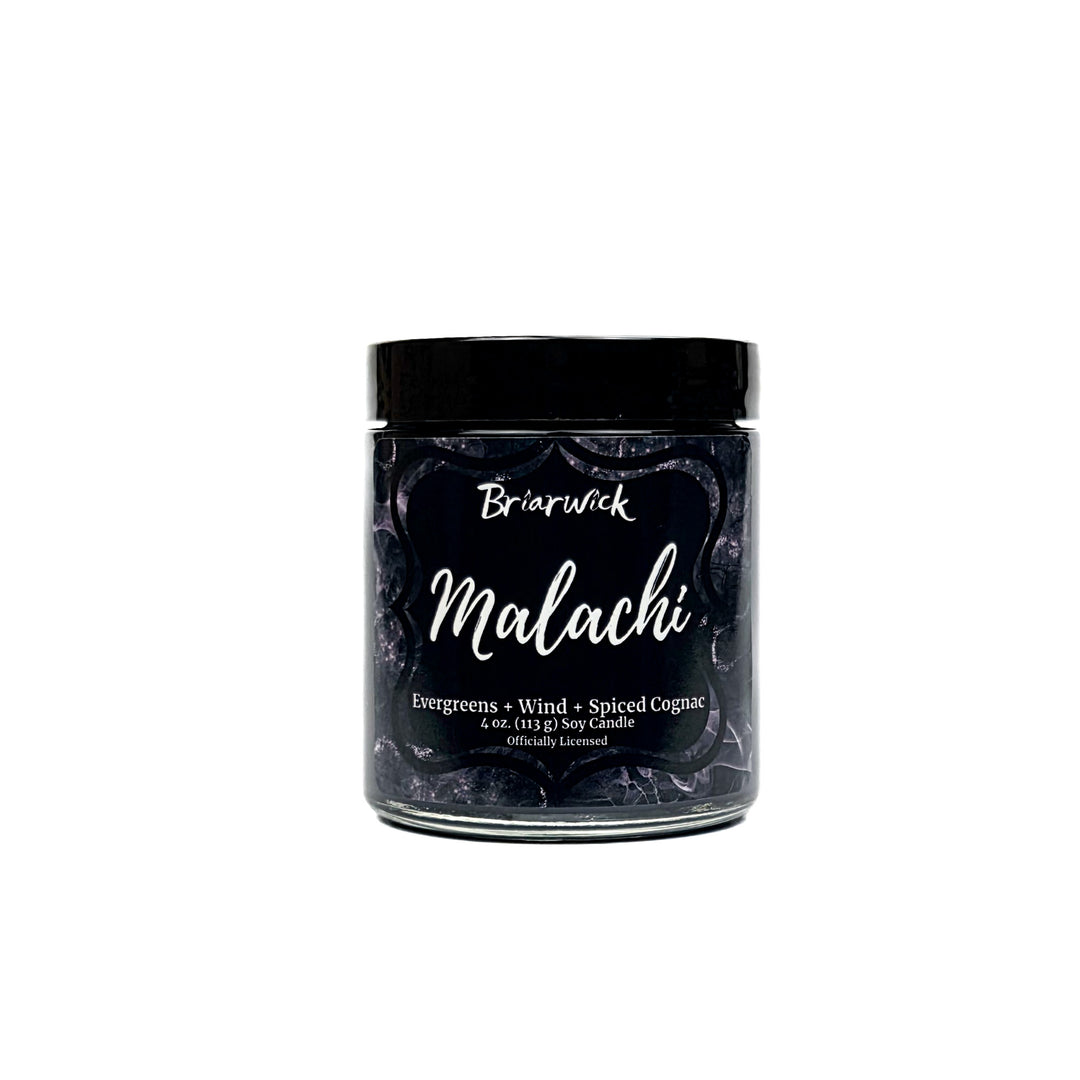 Malachi 4oz black candle with black and silver marbled glitter label on a white background