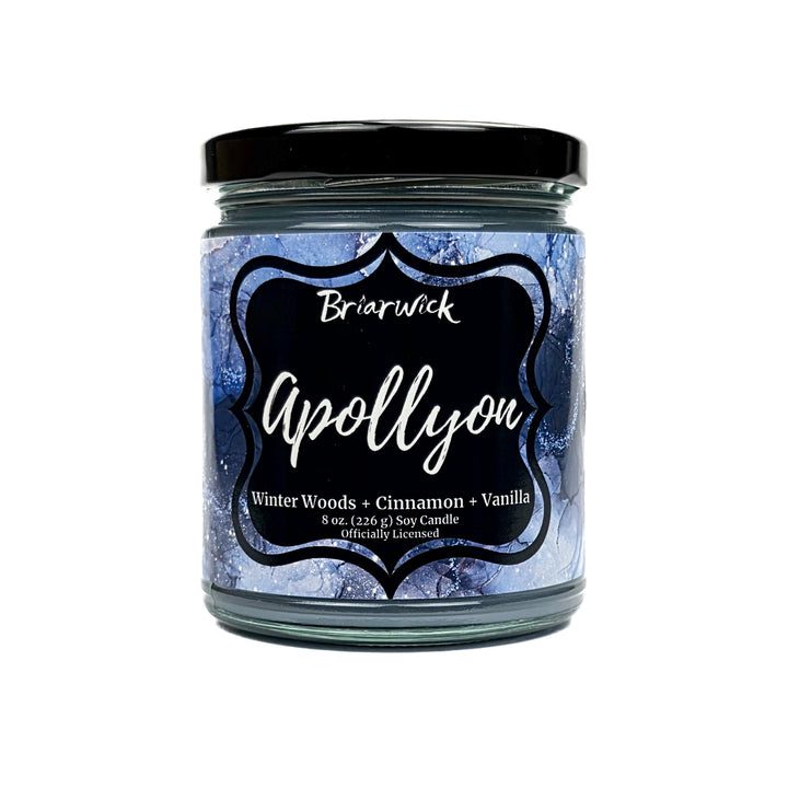Apollyon 8oz light blue candle with blue and silver marbled glitter label on a white background