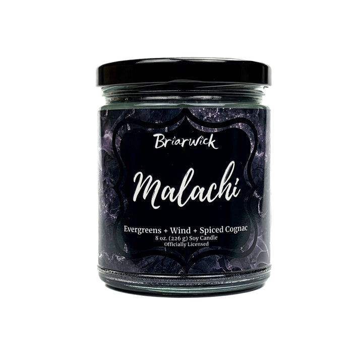 Malachi 8oz black candle with black and silver marbled glitter label on a white background