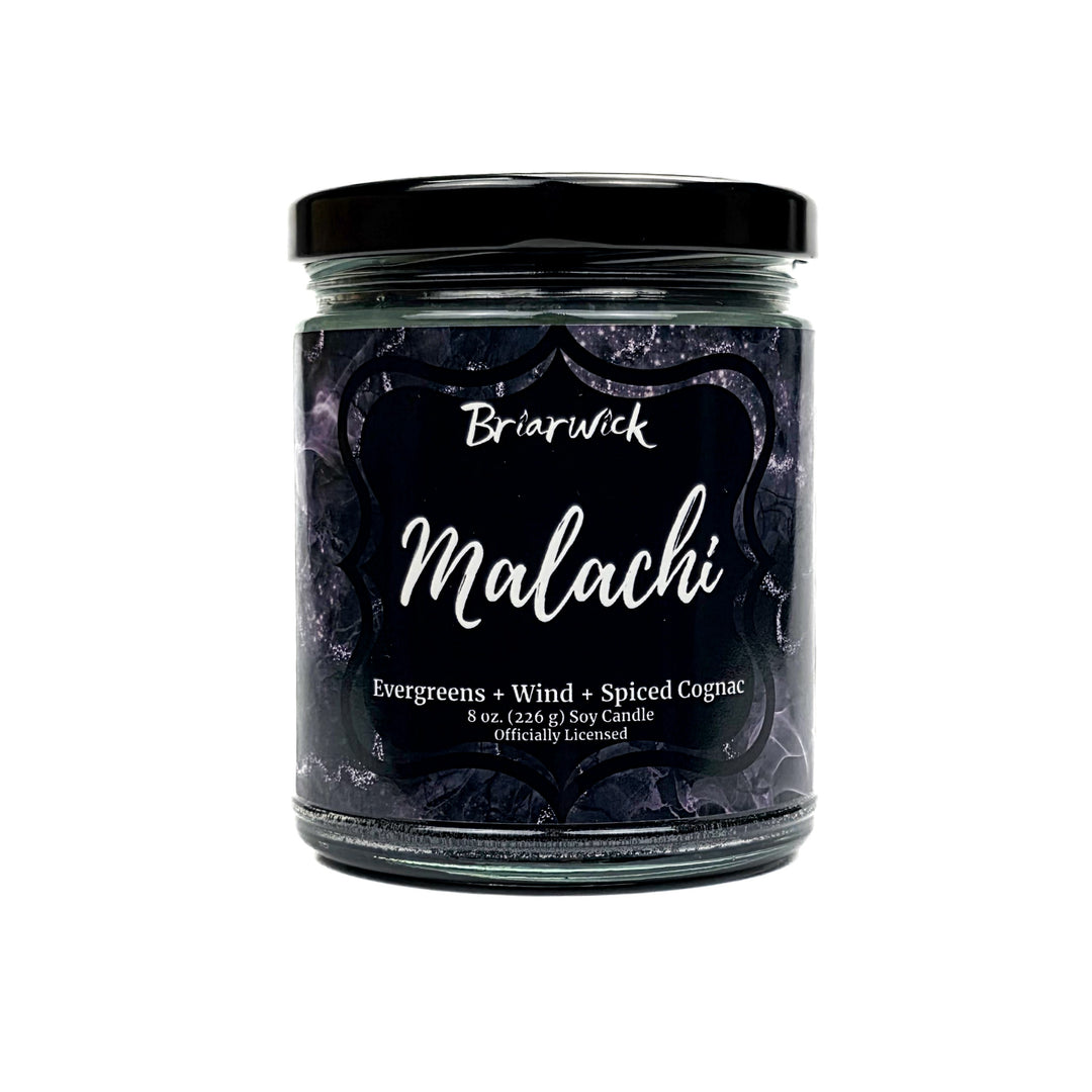 Malachi 8oz black candle with black and silver marbled glitter label on a white background