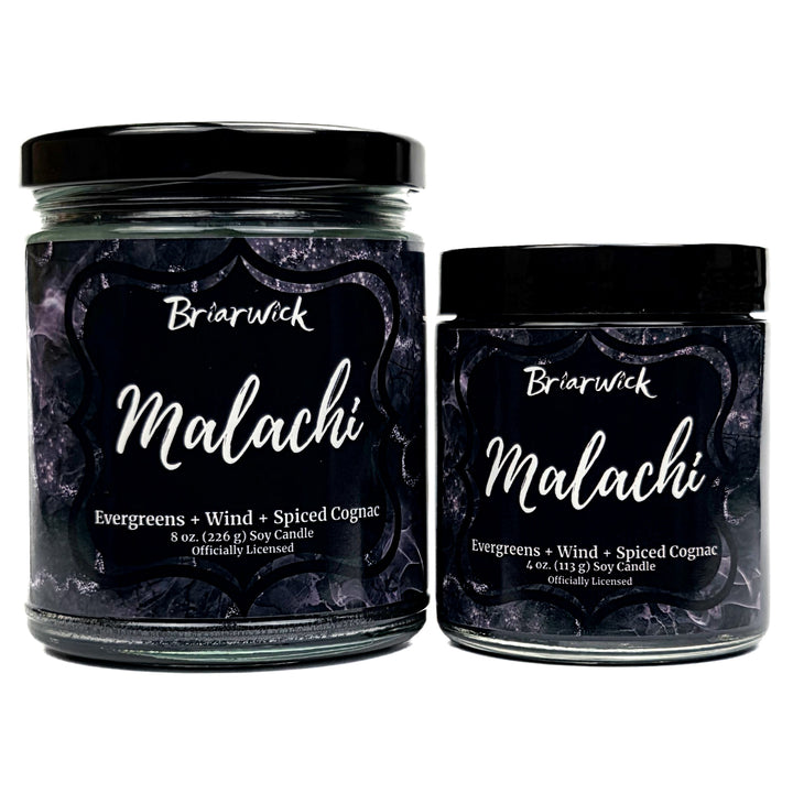 Malachi 8oz & 4oz black candle with black and silver marbled glitter label on a white background