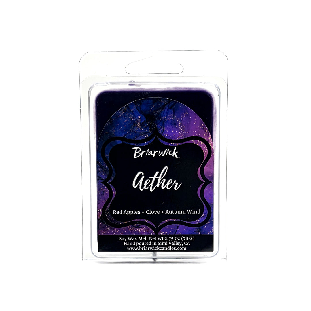 Aether 2oz deep purple wax melt with purple and gold marbled glitter label on a white background