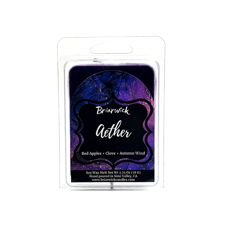 Aether 2oz deep purple wax melt with purple and gold marbled glitter label on a white background
