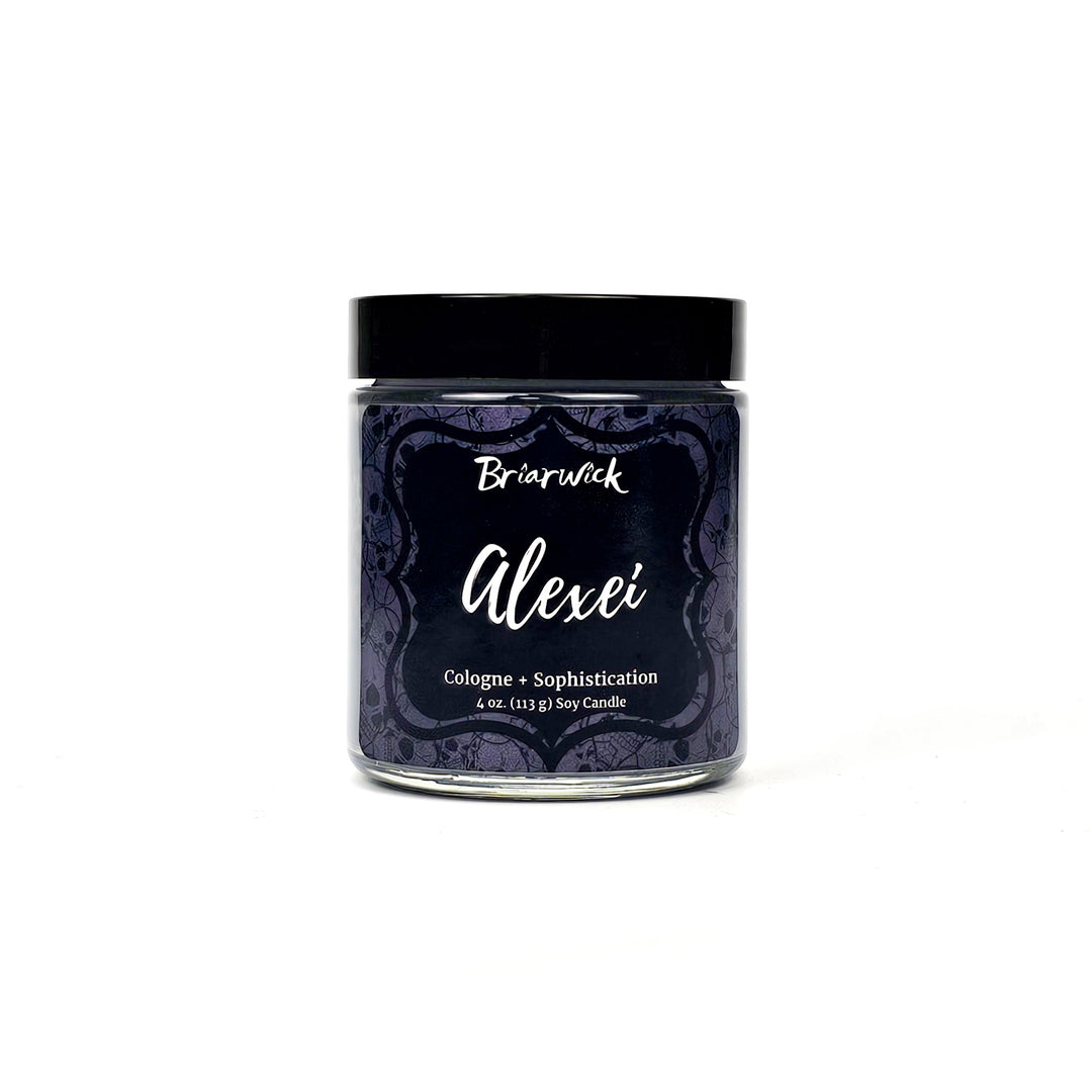 Alexei 4oz flint gray candle with gray skull design on a white background