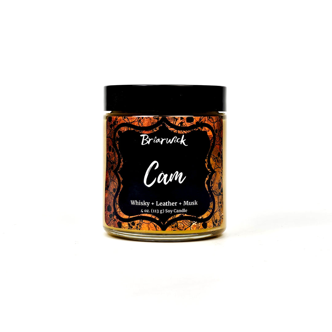 Cam 4oz gold candle with gold skull design on a white background