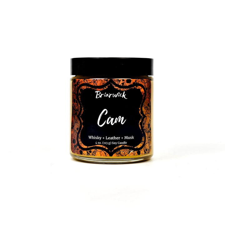 Cam 4oz gold candle with gold skull design on a white background