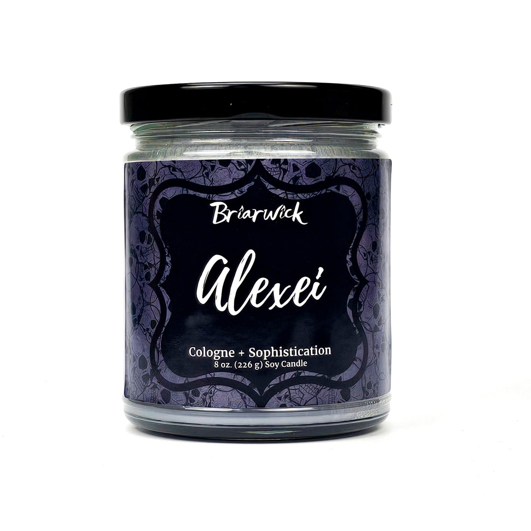 Alexei 8oz flint gray candle with gray skull design on a white background