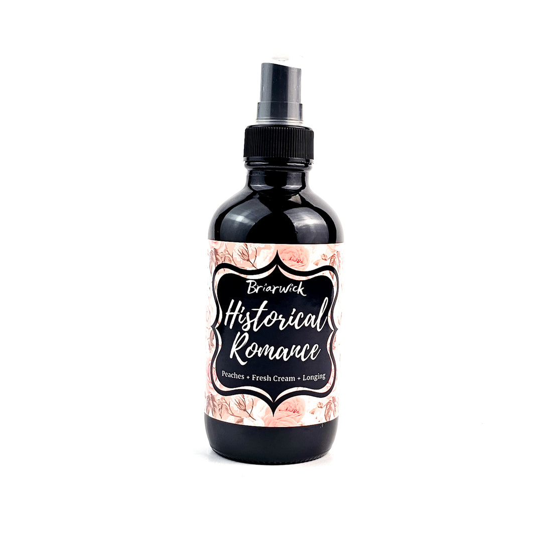 Historical Romance 4oz Linen Spray with pale orange floral design on a white background