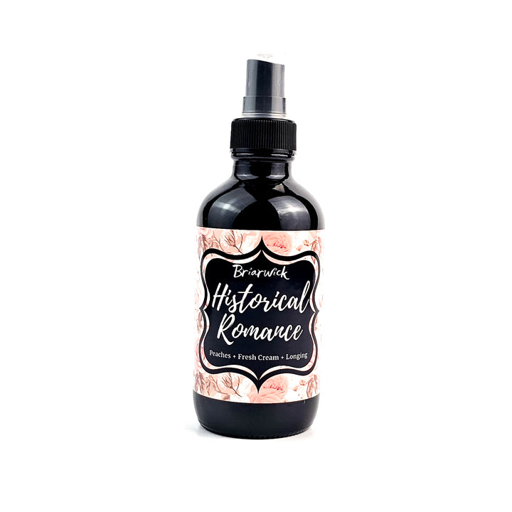Historical Romance 4oz Linen Spray with pale orange floral design on a white background