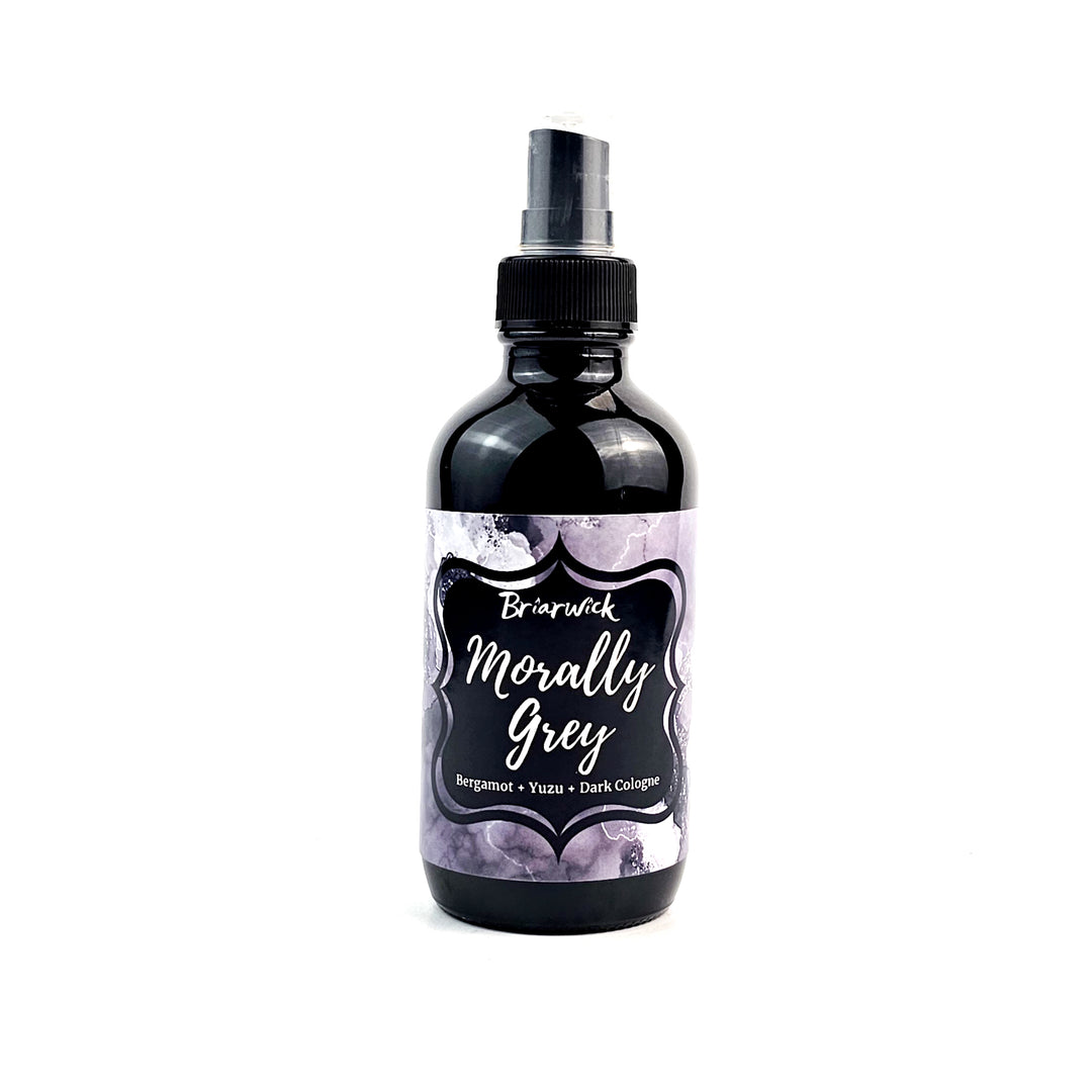 Morally Grey 4oz Linen Spray with grey floral design on a white background