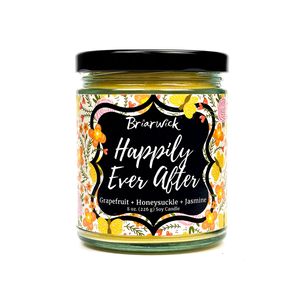 Happily Ever After 8oz dandelion yellow candle with floral design on a white background