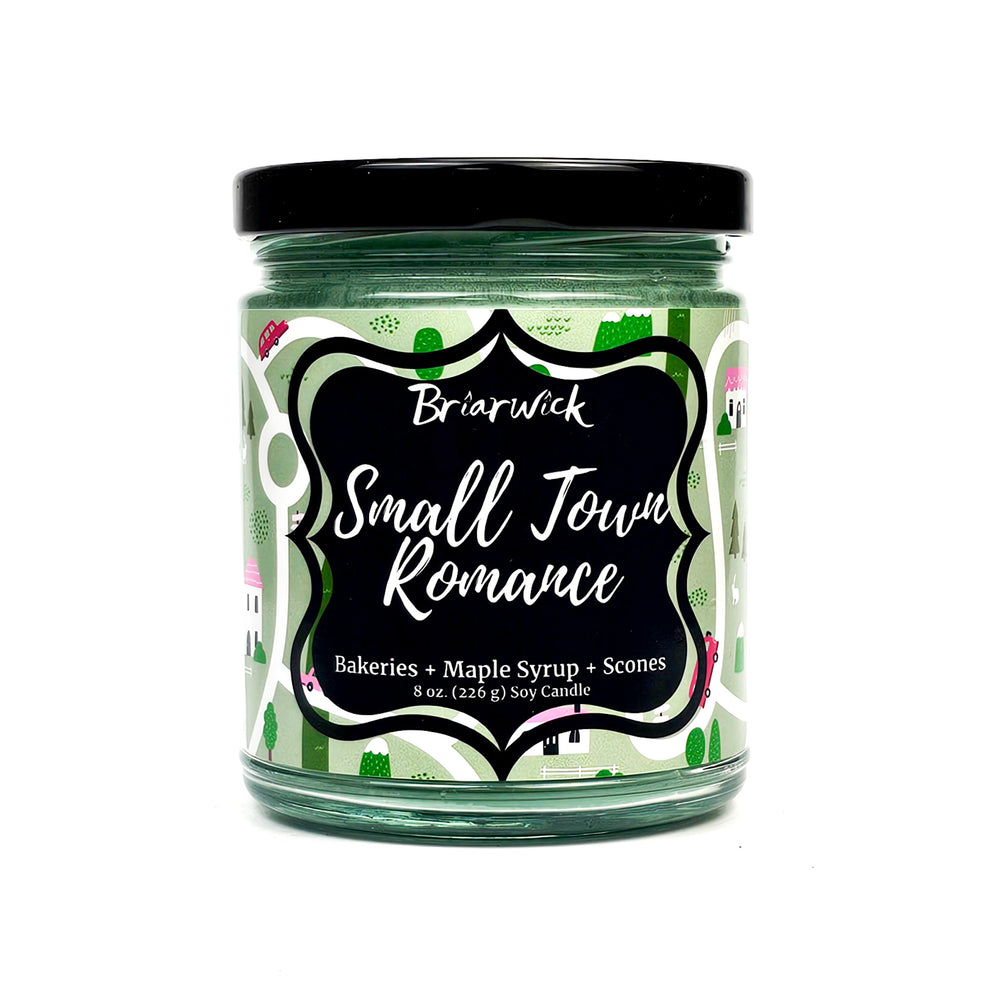 Small Town Romance 8oz pastel green candle with green map design on a white background