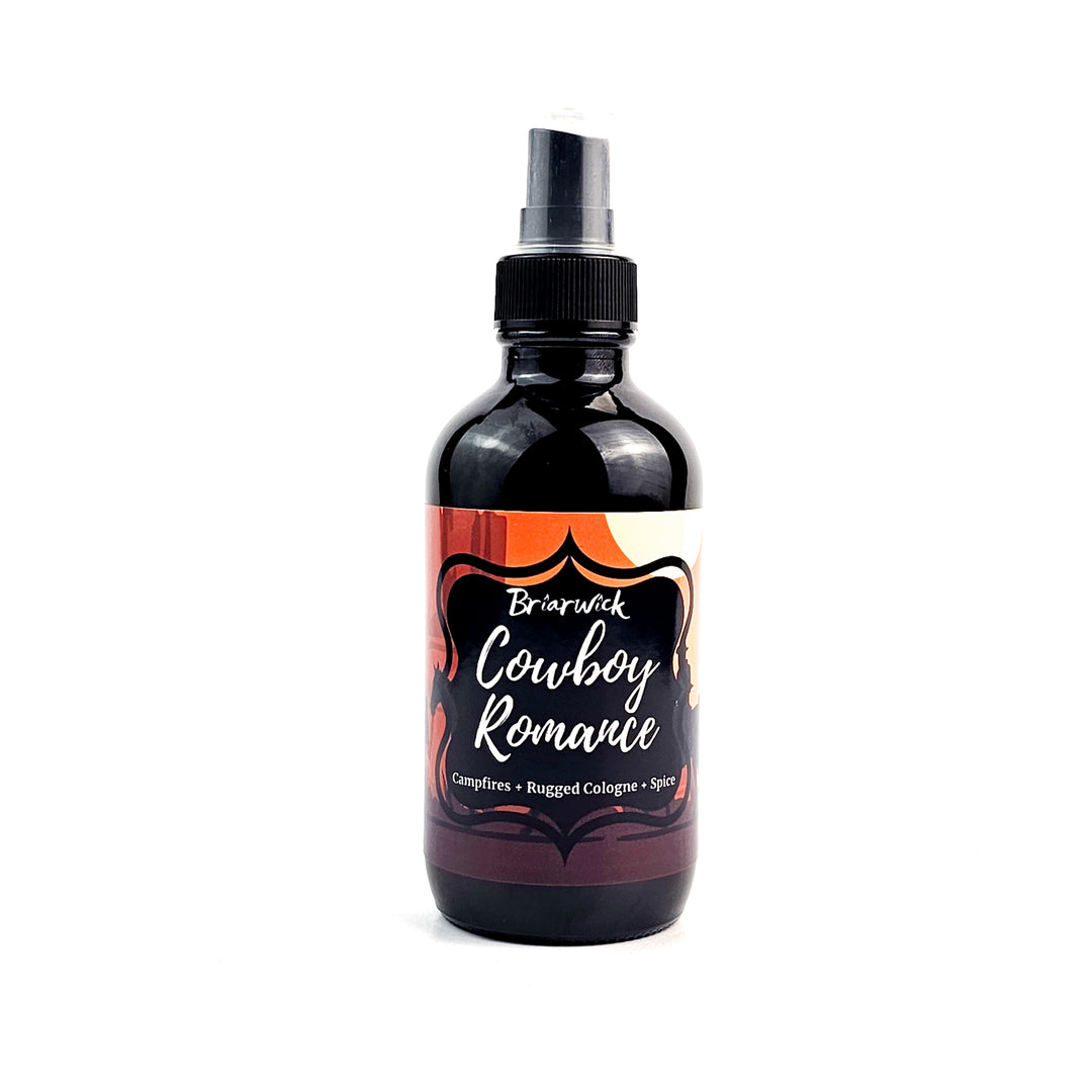 Cowboy Romance 4oz Linen Spray with desert scene design on a white background