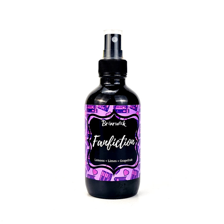 Fanfiction 4oz Linen Spray with violet bookstack design on a white background