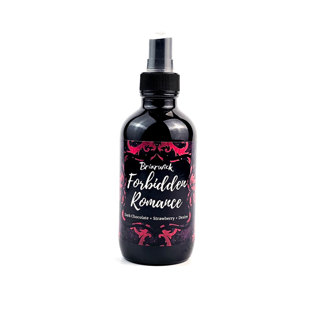 Forbidden Romance 4oz Linen Spray with red ornamental design on a white background