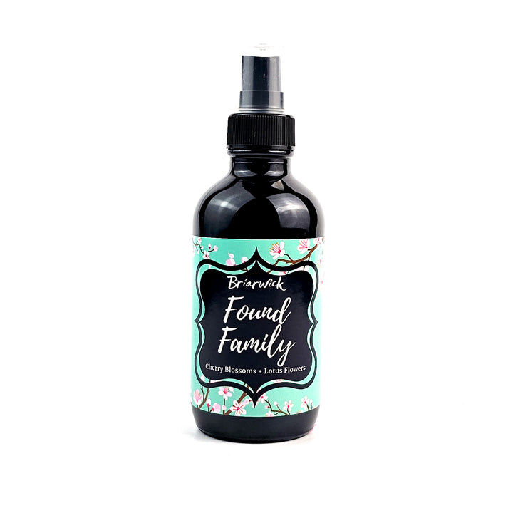 Found Family 4oz Linen Spray with turquoise cherry blossom design on a white background