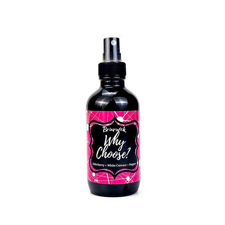 Why Choose? 4oz Linen Spray with magenta & white line design on a white background