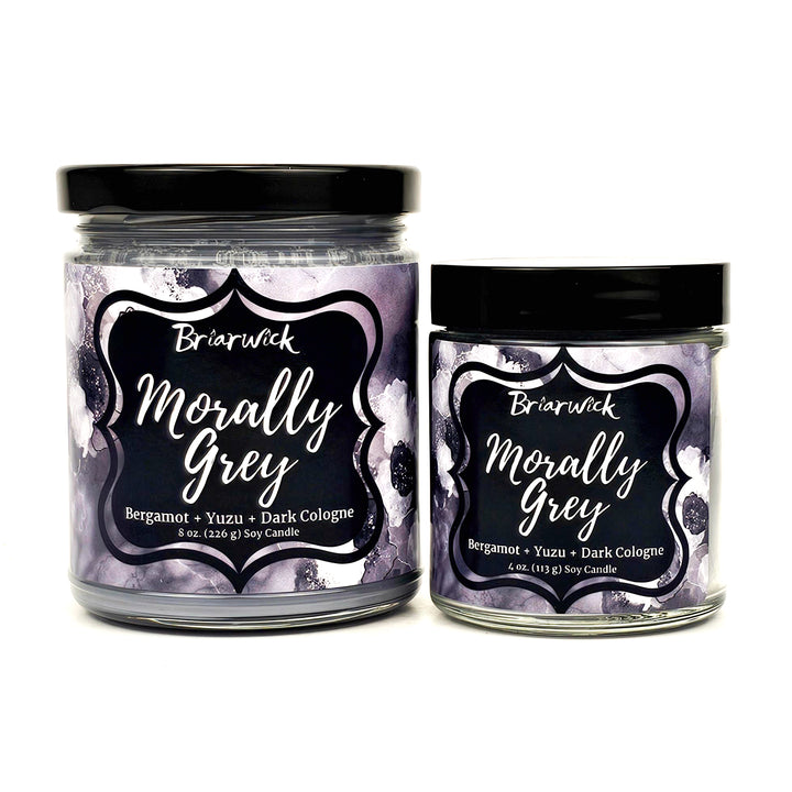 Morally Grey 8oz & 4oz flint grey candles with grey floral designs on a white background