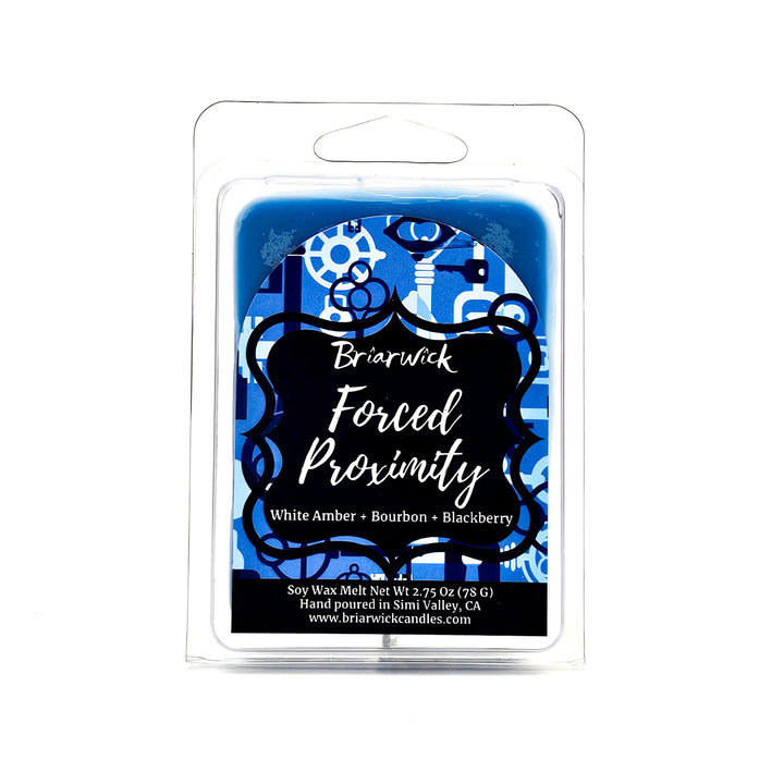 Forced Proximity 2oz steel blue Wax Melt with blue lock & key design on a white background