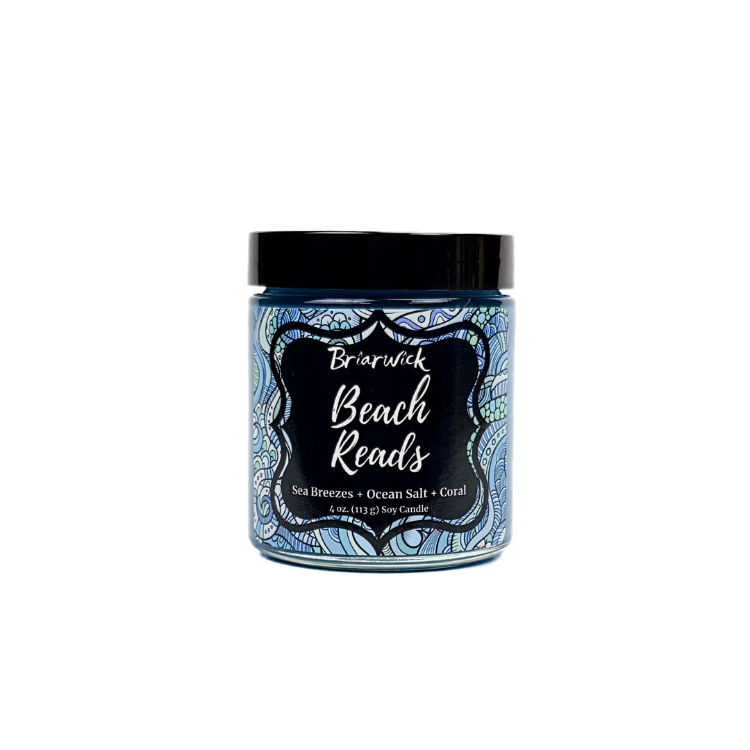 Beach Reads 4oz pastel blue candle with blue ornamental design on a white background