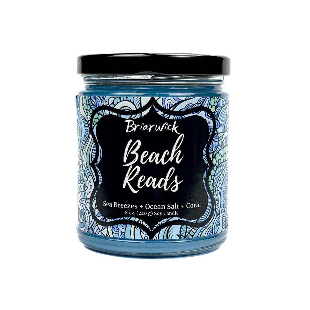 Beach Reads 8oz pastel blue candle with blue ornamental design on a white background