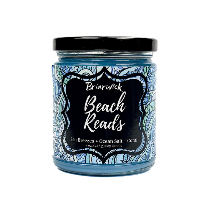 Beach Reads 8oz pastel blue candle with blue ornamental design on a white background