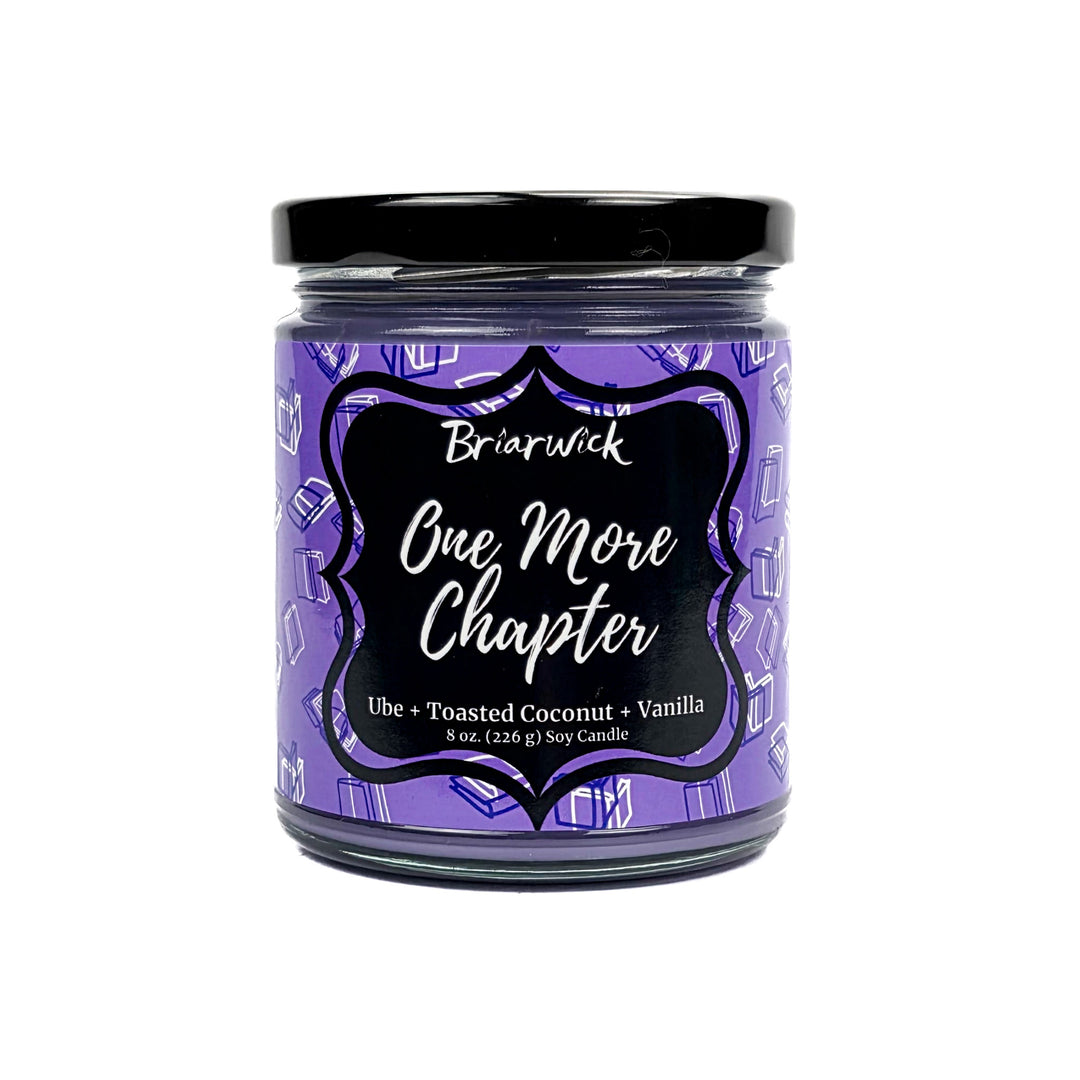 One More Chapter 8oz lavender candle with purple book design on a white background