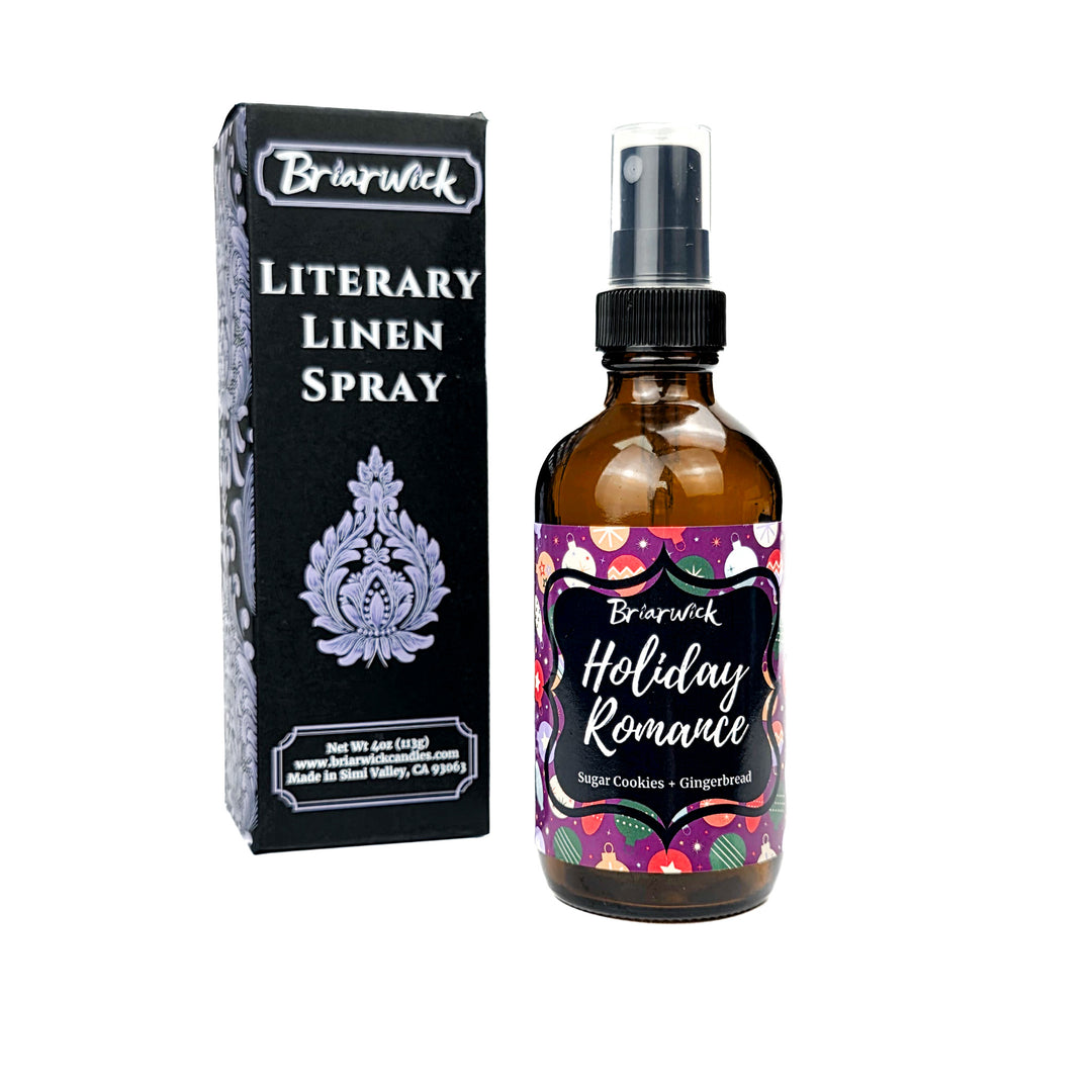 Holiday Romance 4oz Linen Spray with purple background and colorful ornament design on a white background
