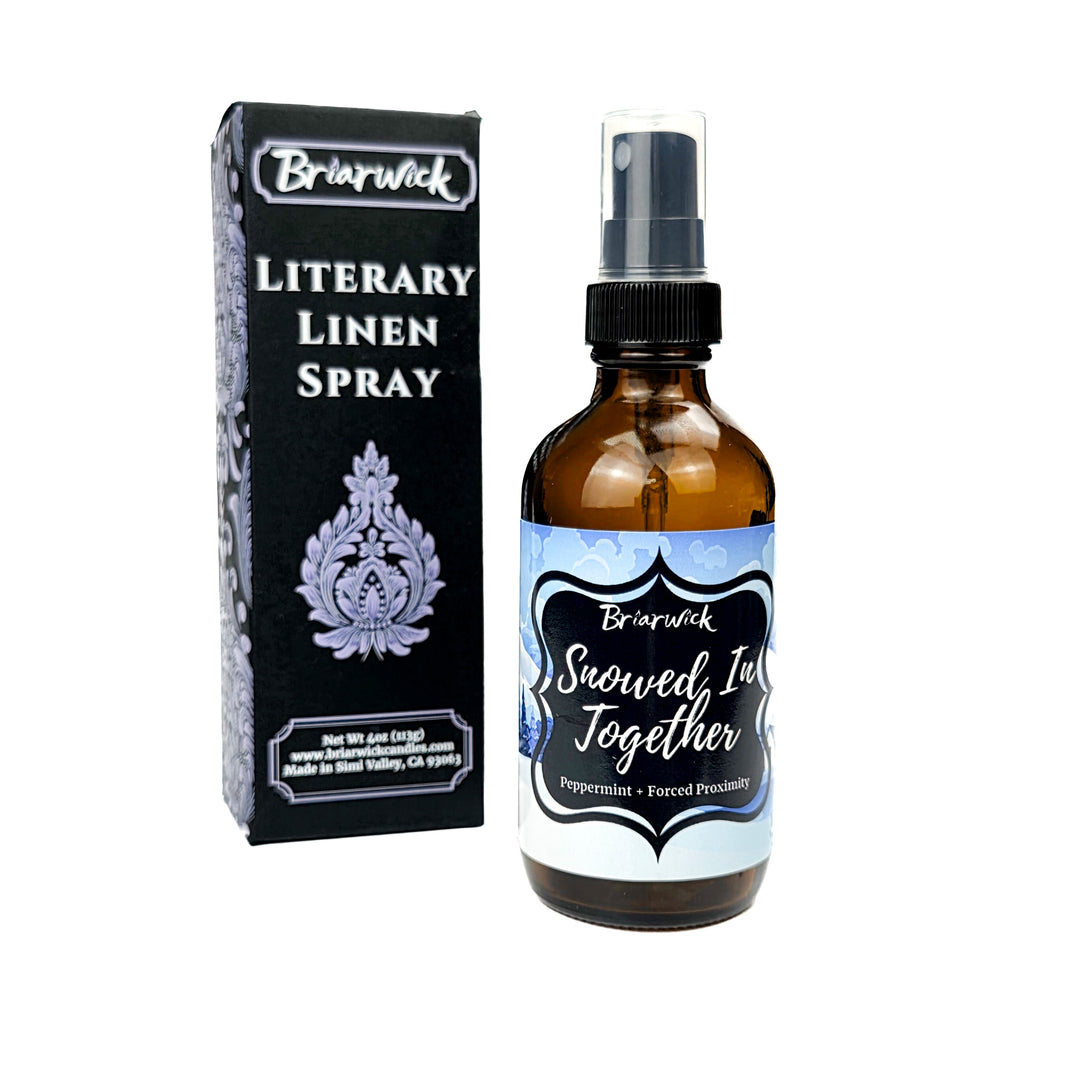 Snowed In Together 4oz Linen Spray with blue and white snow covered lodge design on a white background