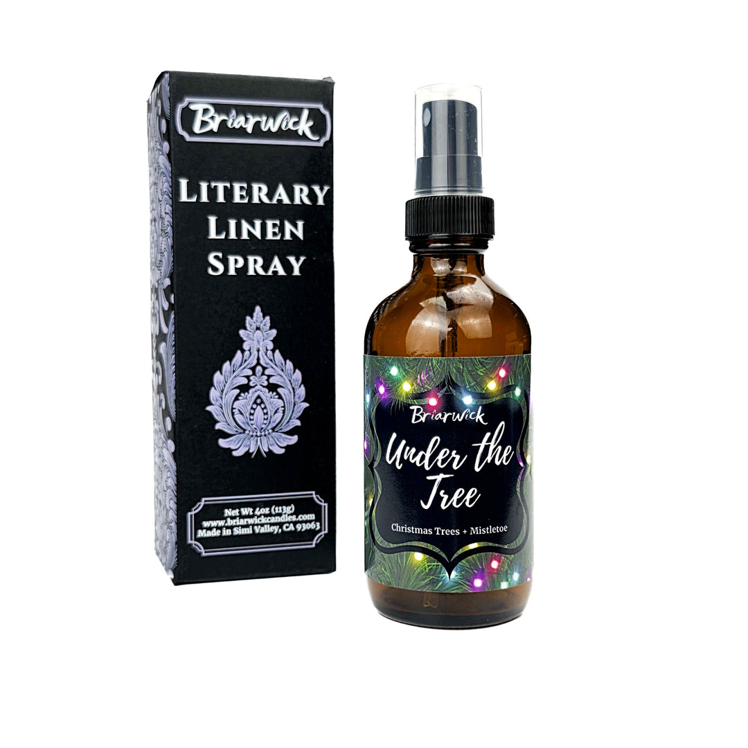 Under the Tree 4oz Linen Spray with christmas tree and colorful lights design on a white background