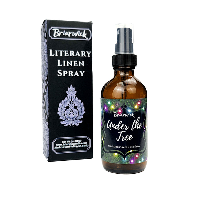 Under the Tree 4oz Linen Spray with christmas tree and colorful lights design on a white background