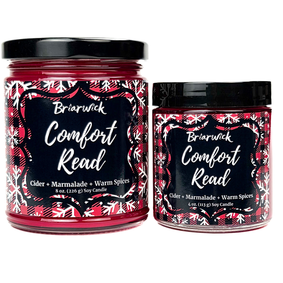 Comfort Read 8oz and 4oz colored candle with red flannel and white snowflake design on a white background