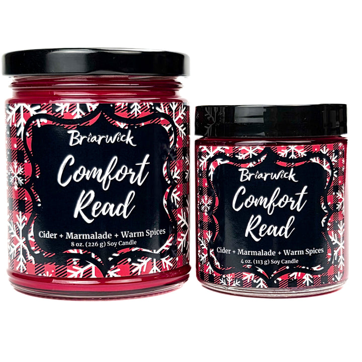 Comfort Read 8oz and 4oz colored candle with red flannel and white snowflake design on a white background