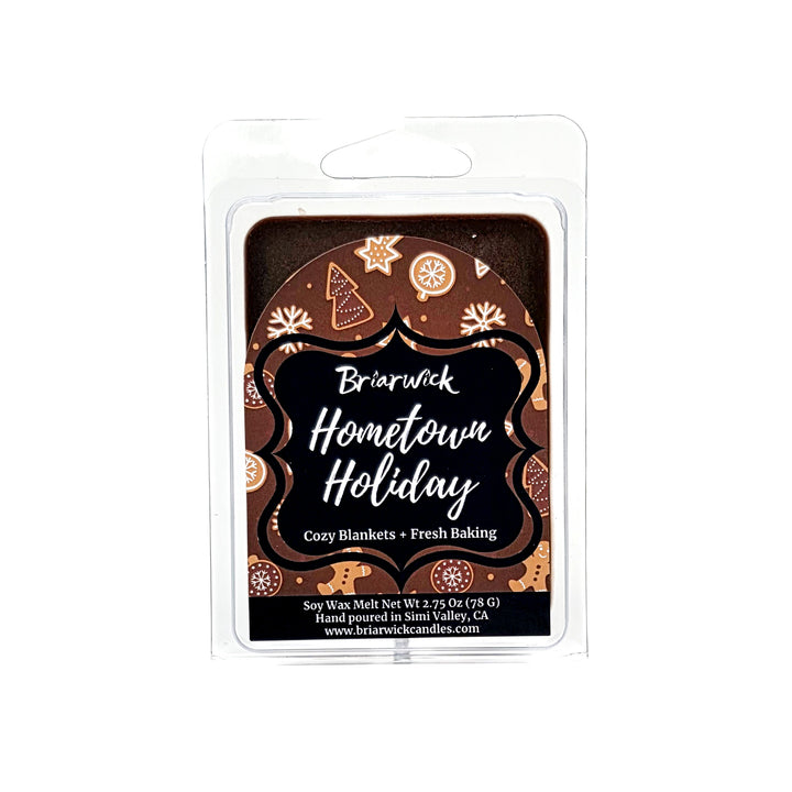 Hometown Holiday  2oz colored Wax Melt package with brown and white decorated gingerbread  design on a white background